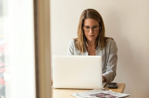 Woman working on a computer.