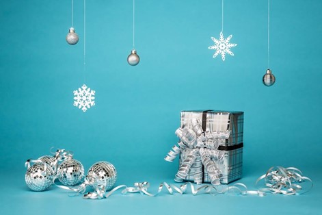 Wrapped Christmas gifts over a blue background