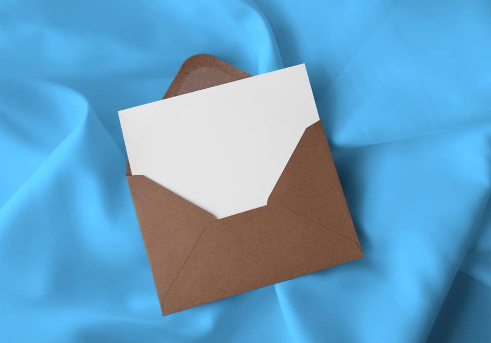 Brown envelope on blue sheet