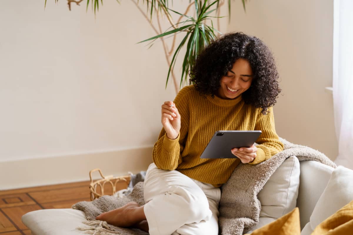 Smiling woman using iPad