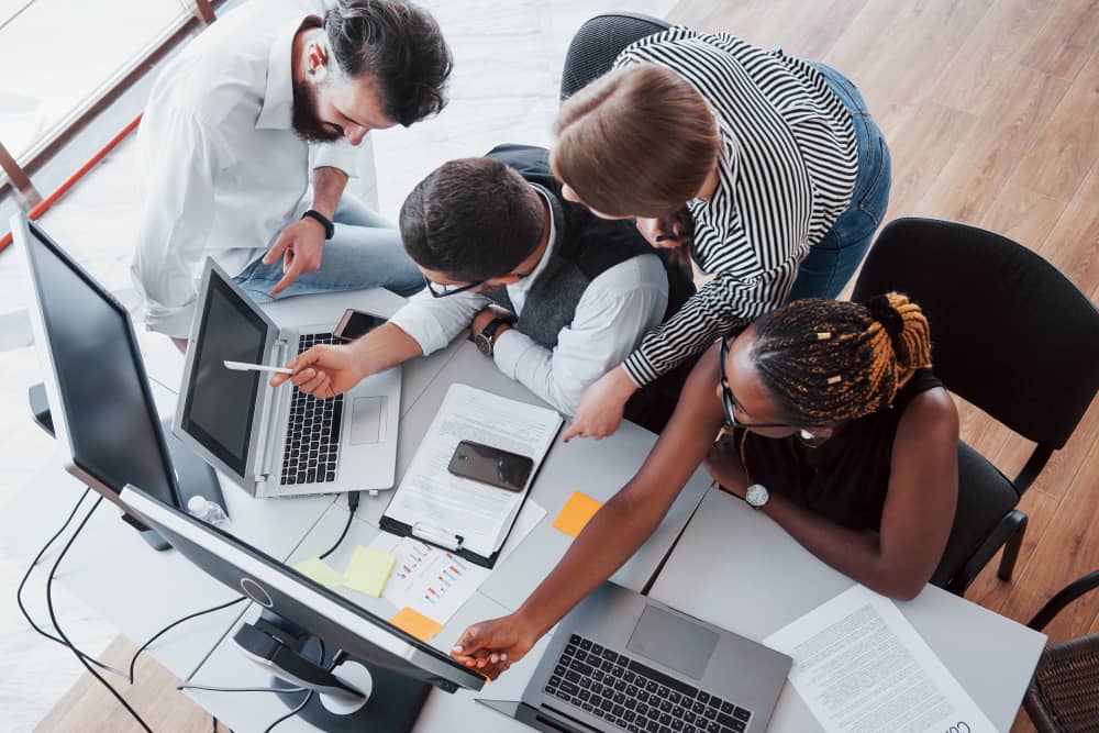 Group of busy-email marketers working in the office