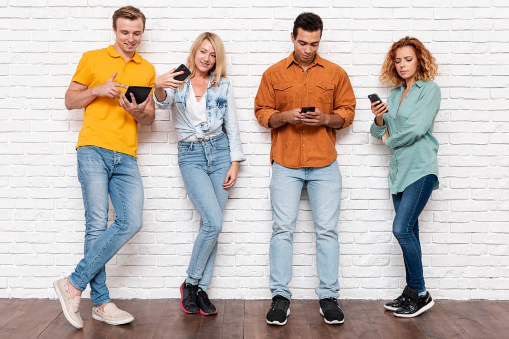 Different people looking at their phone - Mail Privacy Protection