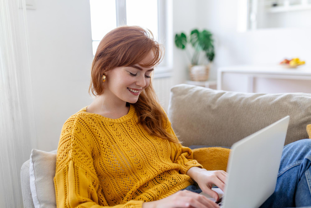 Young beautiful email marketer doing work from home