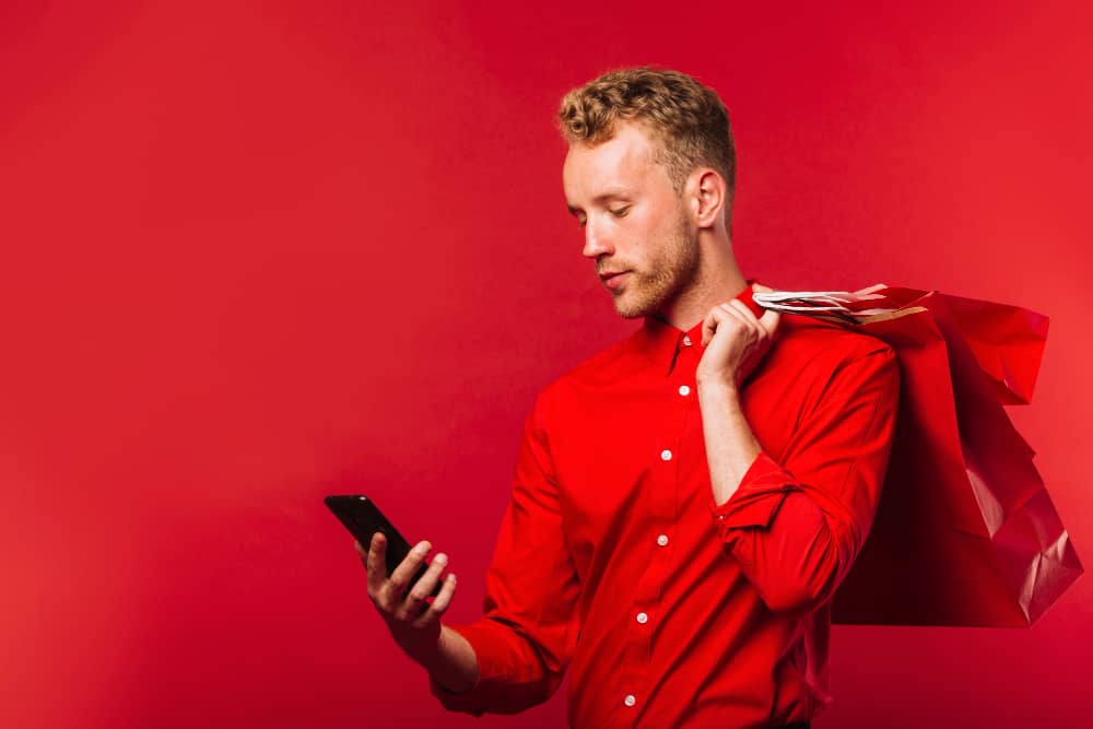 B2C client checking his mobile phone