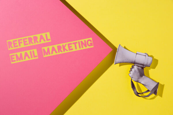 Hand holding megaphone - referral email marketing