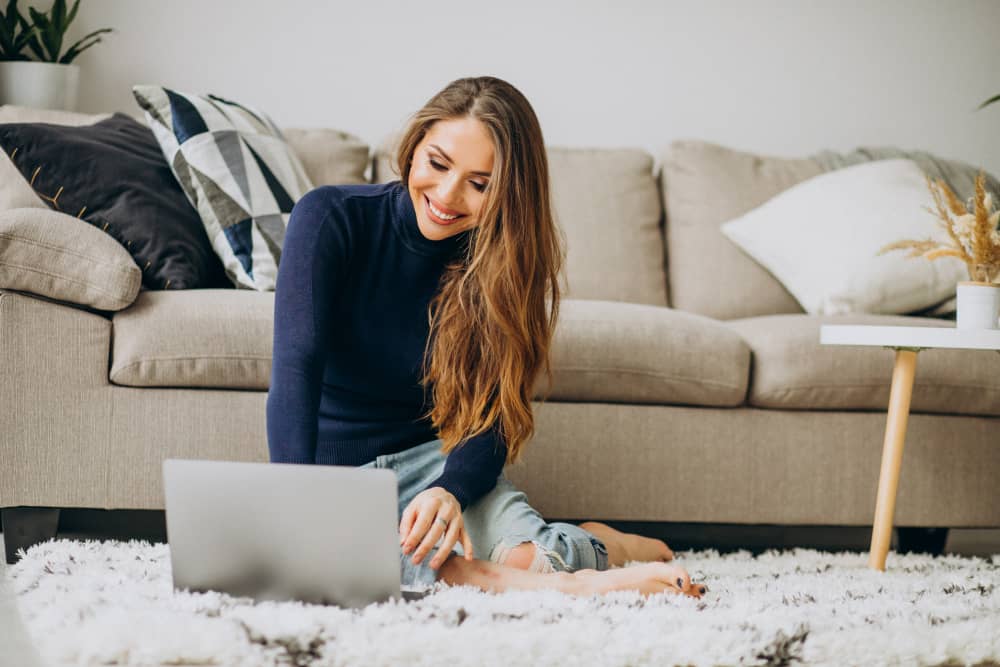 Business woman working on her laptop at home