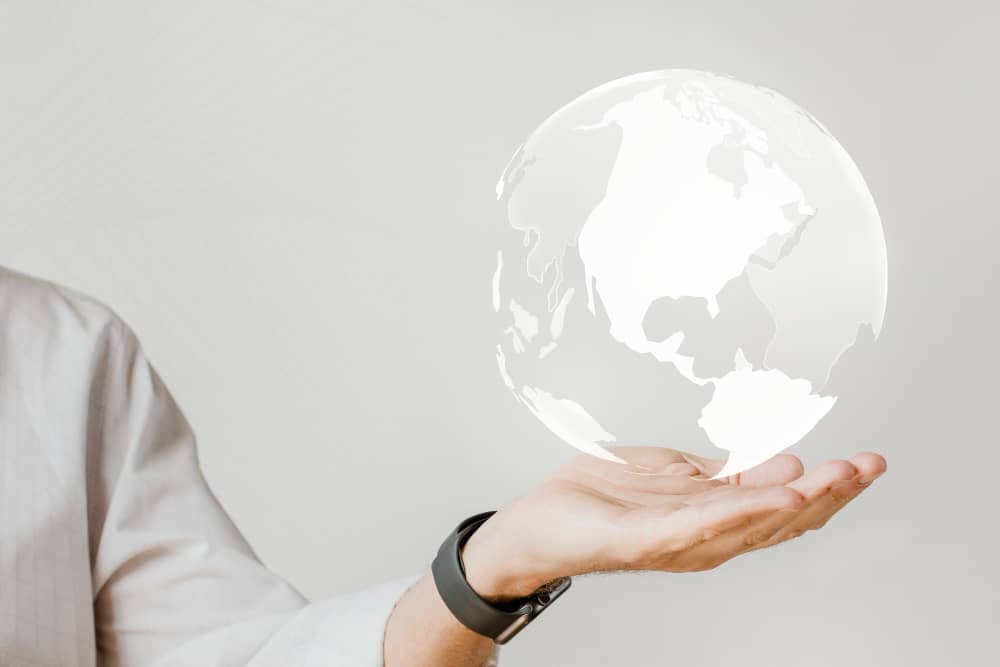 Man Holding Globe, Symbolizing Appealing to International Audiences with Email Marketing