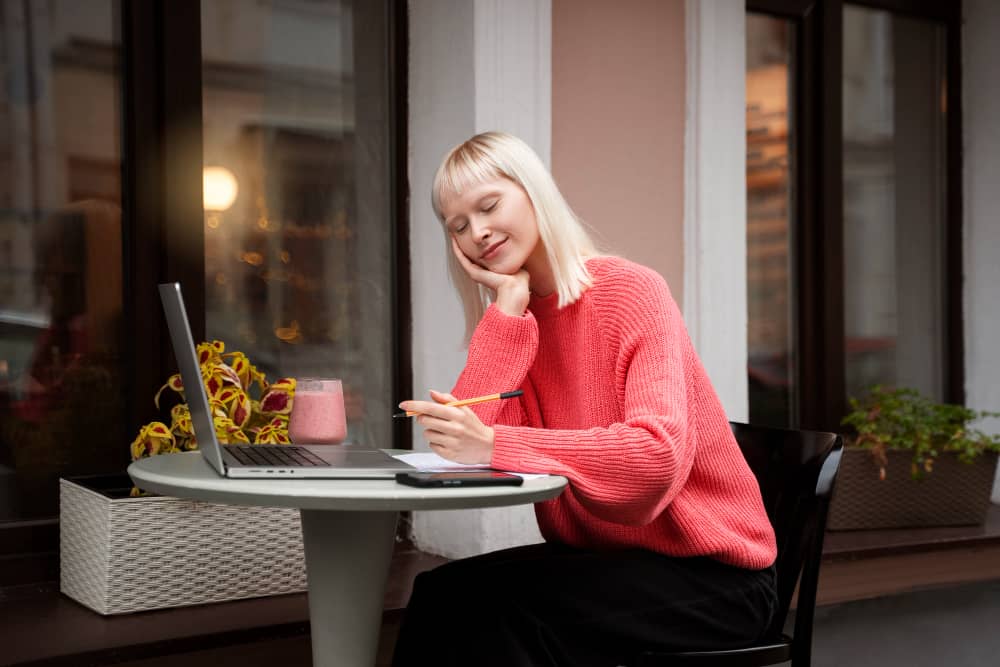 Email marketer working with her laptop