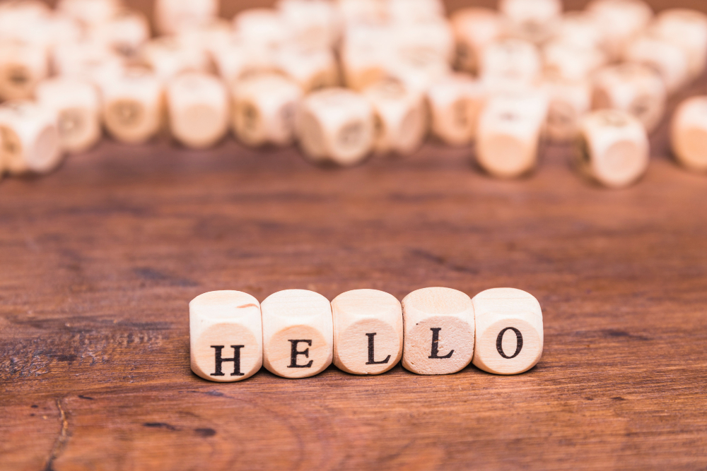 The word hello made with dices on a wooden desk