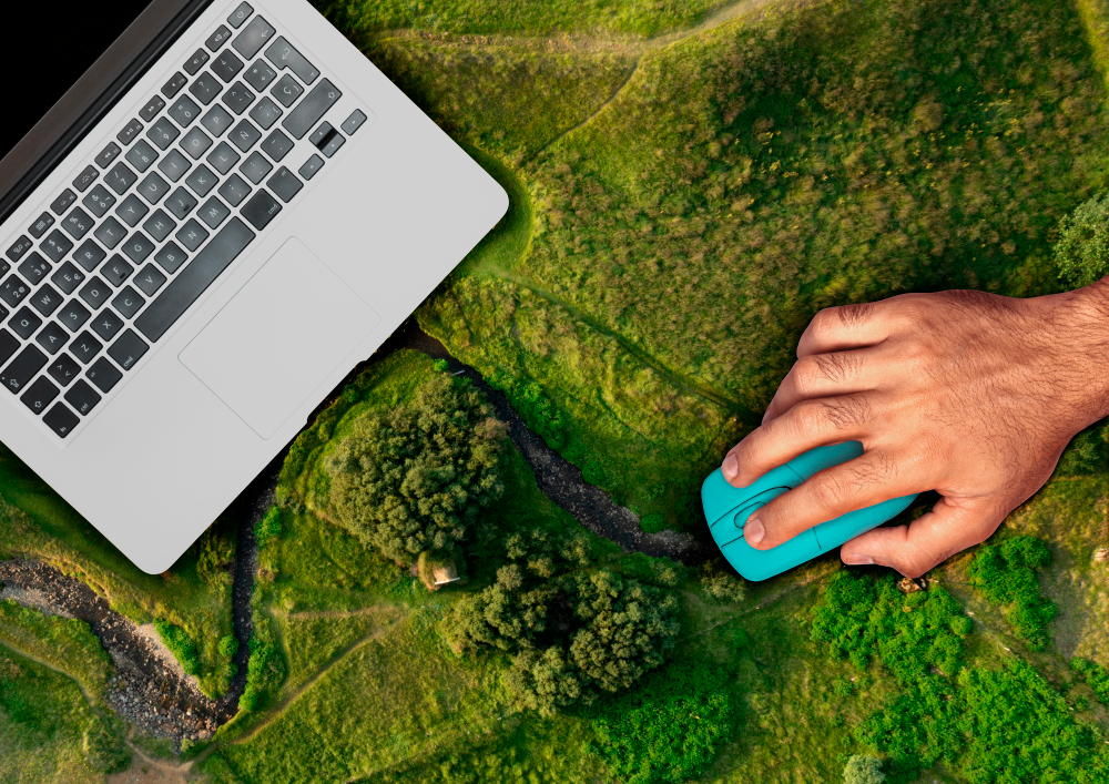 Optimize your mailing list - image of laptop on green field, symbolizing seasonal email marketing