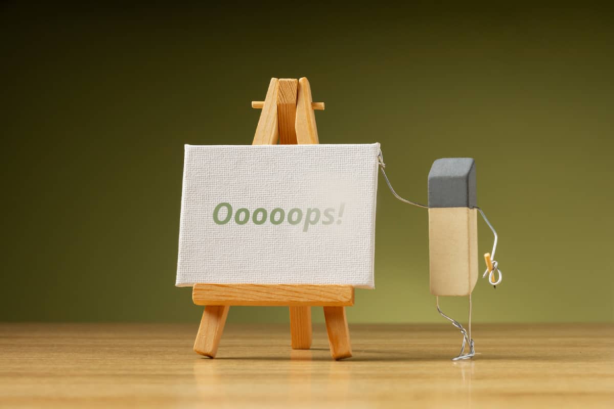 Image of an eraser standing next to a whiteboard, symbolizing error correction emails