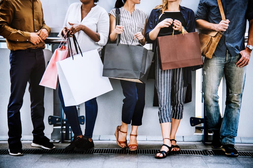 Image of shoppers with shopping bags, symbolizing social proof