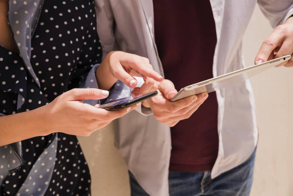 People looking at their phones, clicking on a marketing email