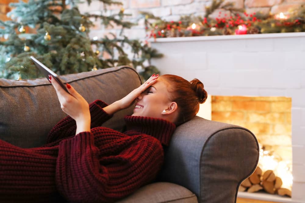 Laughing customer reading an email from their iPad