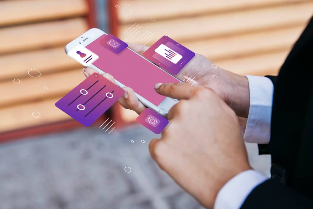 Person holding a phone with graphics symbolizing microcopy in email marketing