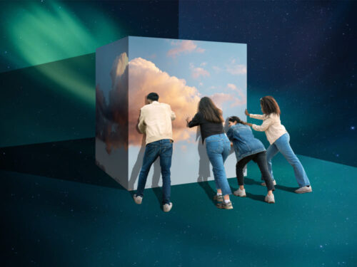 A team pushing a block of clouds, symbolizing dynamic content