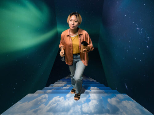 Abstract image of a woman walking on a staircase of clouds