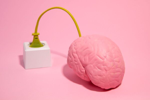 A brain connected to a plug, symbolizing AI in email marketing
