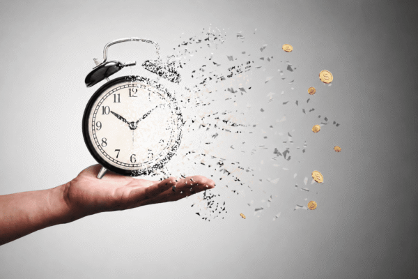 A clock dissolving into pieces and coins, symbolizing time decay in email marketing