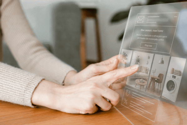 A woman clicking on a product recommendation email on a virtual screen, symbolizing the use of browsing history in email marketing